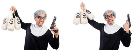 Man in nun dress with handgun and moneybagsの写真素材
