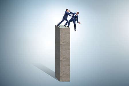 Business competition concept with two businessmenの写真素材