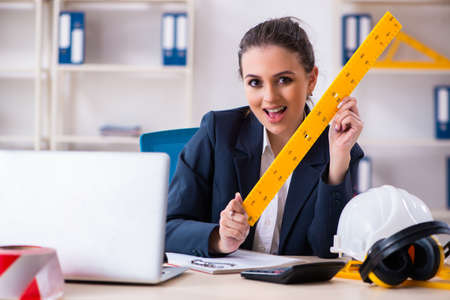 Young female architect working in the officeの写真素材