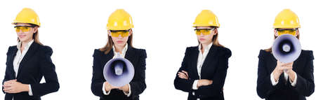 Female builder with megaphone isolated on whiteの写真素材