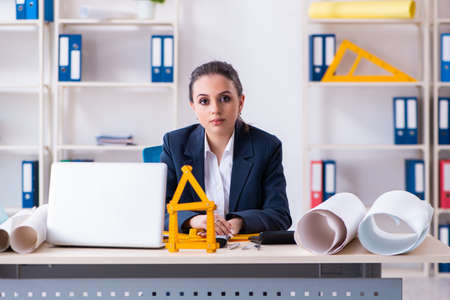 Young female architect working in the officeの写真素材
