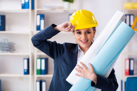 Young female architect working in the office