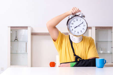 Young man after car accident suffering at homeの写真素材