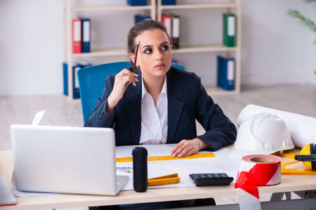 Young female architect working in the officeの写真素材