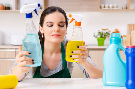 Young female contractor doing houseworkの写真素材