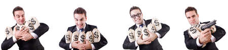 Businessman with money sacks and handgunの写真素材