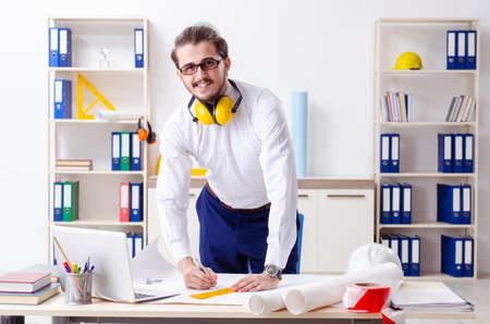 Young male architect working in the officeの写真素材