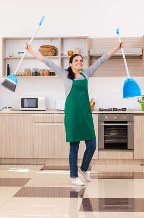 Young female contractor doing houseworkの写真素材