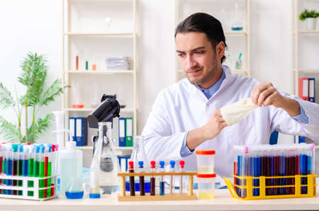 Young male chemist working in the labの写真素材
