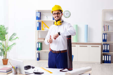 Young male architect working in the officeの写真素材