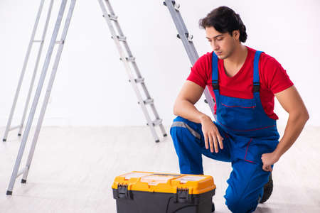 Young handsome contractor working indoorsの写真素材