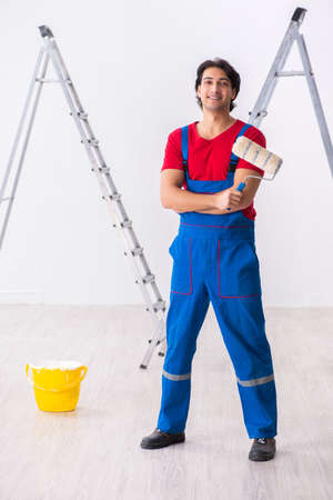 Young handsome contractor working indoorsの写真素材