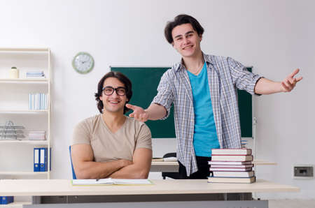Two male students in the classroomの写真素材
