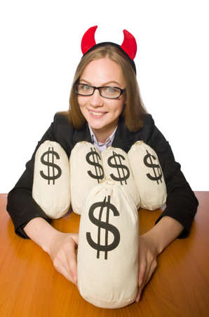 Female employee with money sacks on her tableの写真素材