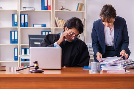 Two lawyers working in the officeの写真素材