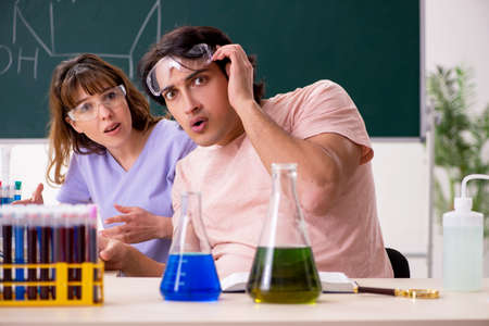Two chemists students in classroomの写真素材