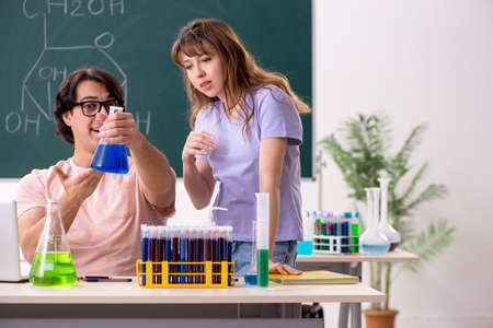 Two chemists students in classroomの写真素材