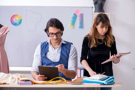Young tailors working in workshop
