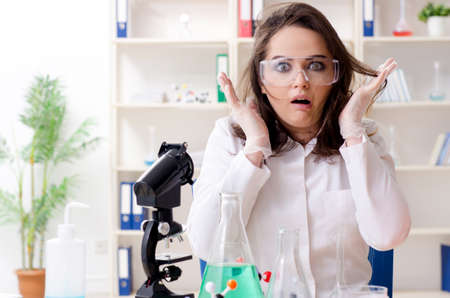 Funny female chemist working in the labの写真素材