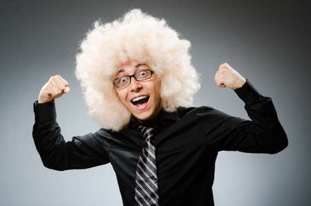Young man wearing afro wigの写真素材