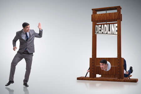 Businessman in deadline concept with guillotineの写真素材