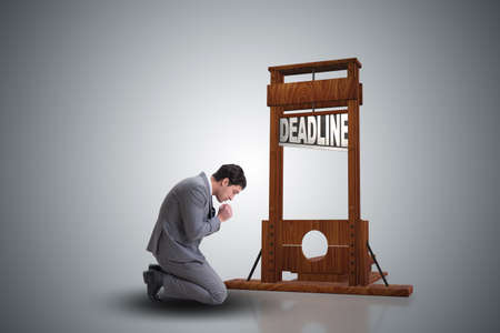 Businessman in deadline concept with guillotineの写真素材