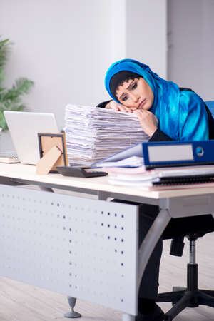 Female employee in hijab working in the officeの写真素材