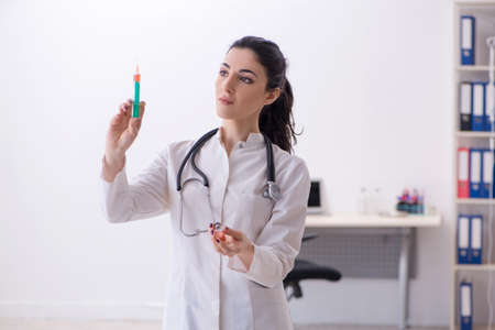 Young female doctor in infusion concept
