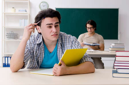 Two male students in the classroomの写真素材