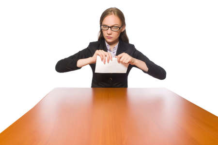 Female employee sitting at long table isolated on whiteの写真素材