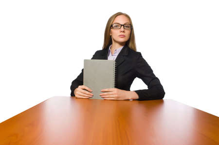 Female employee sitting at long table isolated on whiteの写真素材