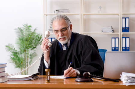 Aged lawyer working in the courthouseの写真素材