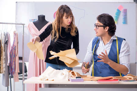 Young tailors working in workshopの写真素材