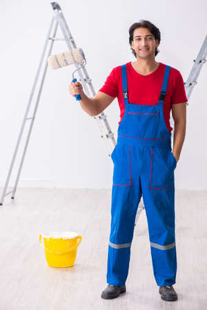 Young handsome contractor working indoorsの写真素材
