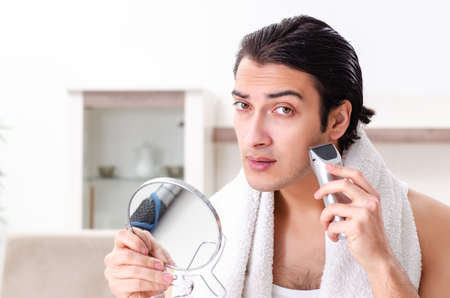 Young handsome man in the bathroomの写真素材