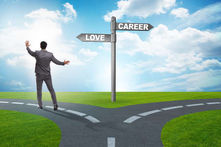 Businessman having hard choice between love and careerの写真素材