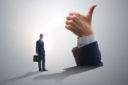 Businessman showing thumbs up gestureの写真素材