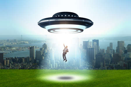 Flying saucer abducting young businessman