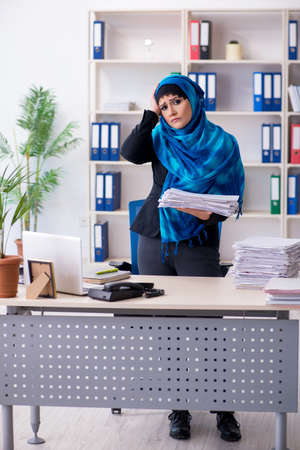 Female employee in hijab working in the officeの写真素材