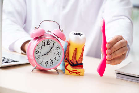 Male doctor stomatologist working in the clinic