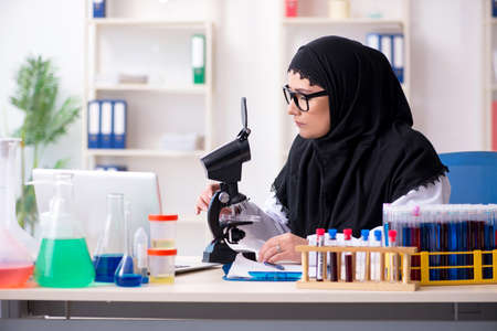 Female chemist in hijab working in the labの写真素材