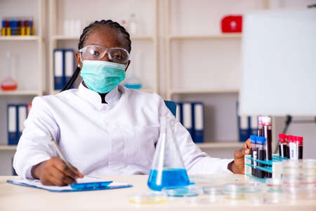 Young black chemist working in the labの写真素材