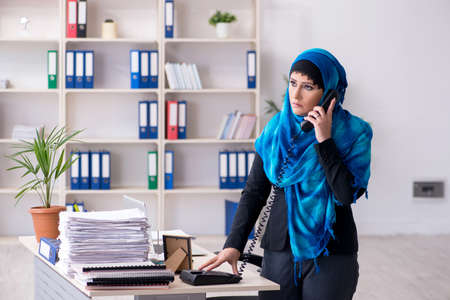 Female employee in hijab working in the officeの写真素材
