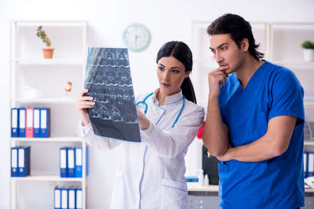 Two young doctors working in the clinic