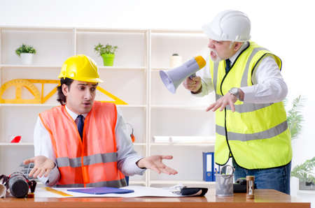 Two engineers colleagues working under project