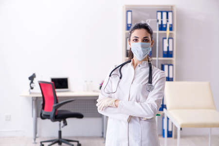 Young female doctor in infusion conceptの写真素材