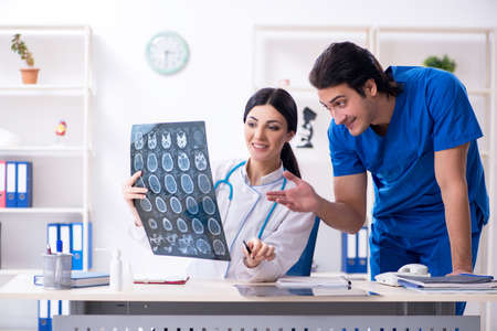 Two young doctors working in the clinic