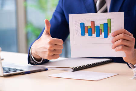 Young male sales analyst in growth concept