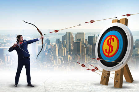 Businessman aiming arrow with bow