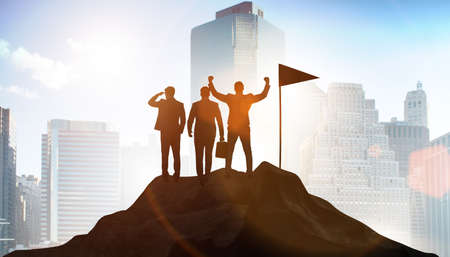 Businessmen in achievement and teamwork conceptの写真素材